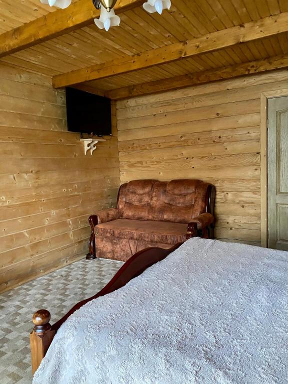 Postel nebo postele na pokoji v ubytování Villa PidStromom