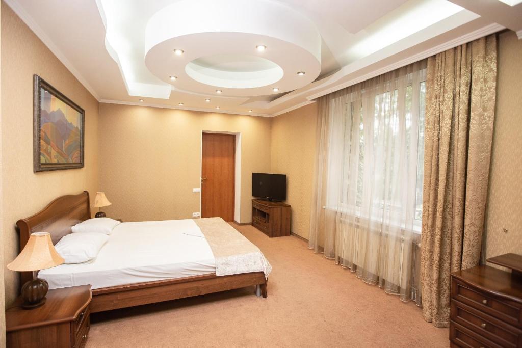 Postel nebo postele na pokoji v ubytování Almira Orion Group Hotel