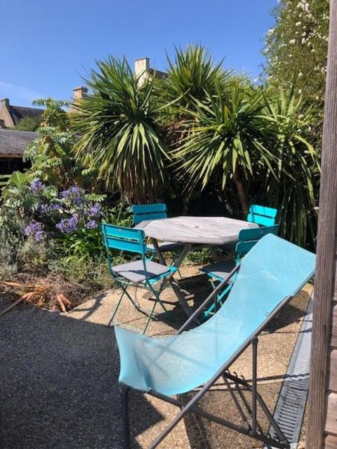 a table and chairs sitting on a patio at Kervran in Plouhinec