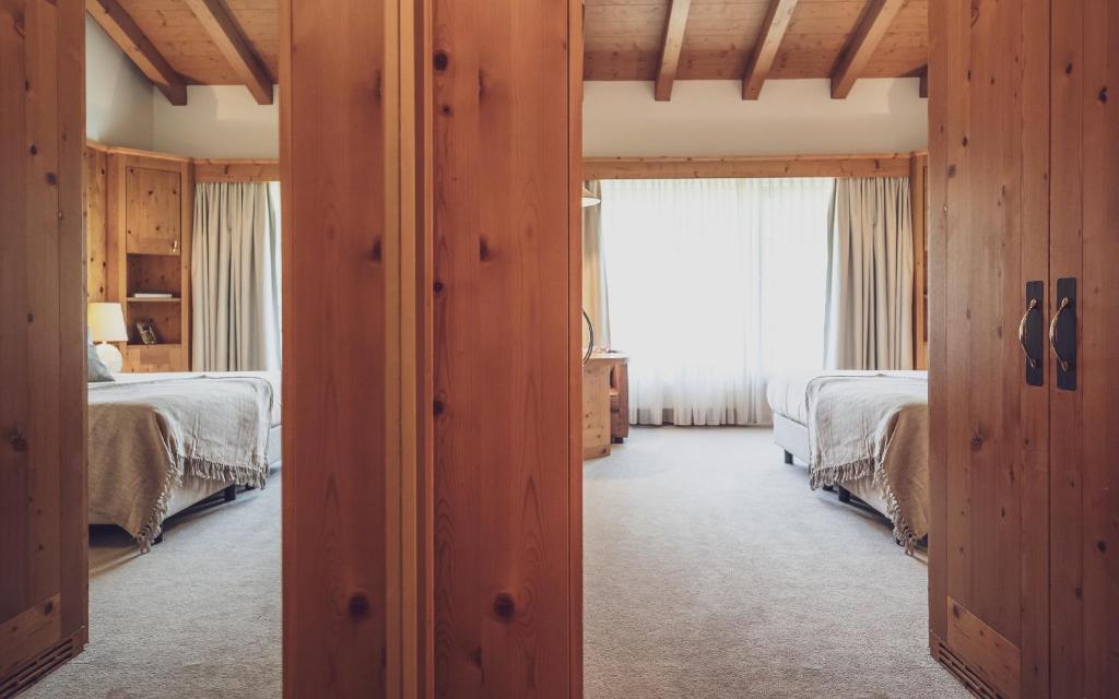 Postel nebo postele na pokoji v ubytování Hotel Waldhuus