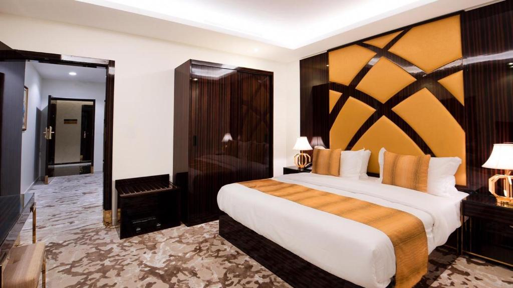 Postel nebo postele na pokoji v ubytování Golden Dream Hotel