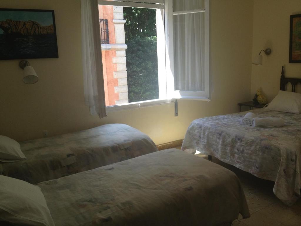Postel nebo postele na pokoji v ubytování Hotel Comodoro