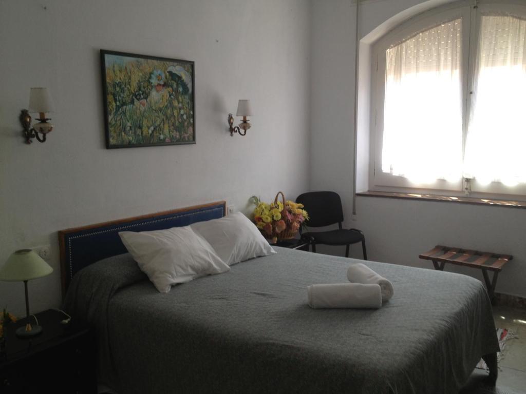 Postel nebo postele na pokoji v ubytování Hotel Comodoro