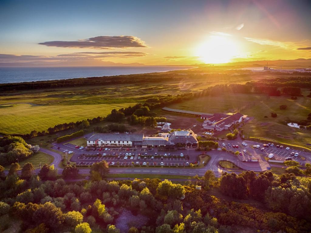 an aerial view of a hotel with the sunset in the background at The Gailes Hotel & Spa in Irvine