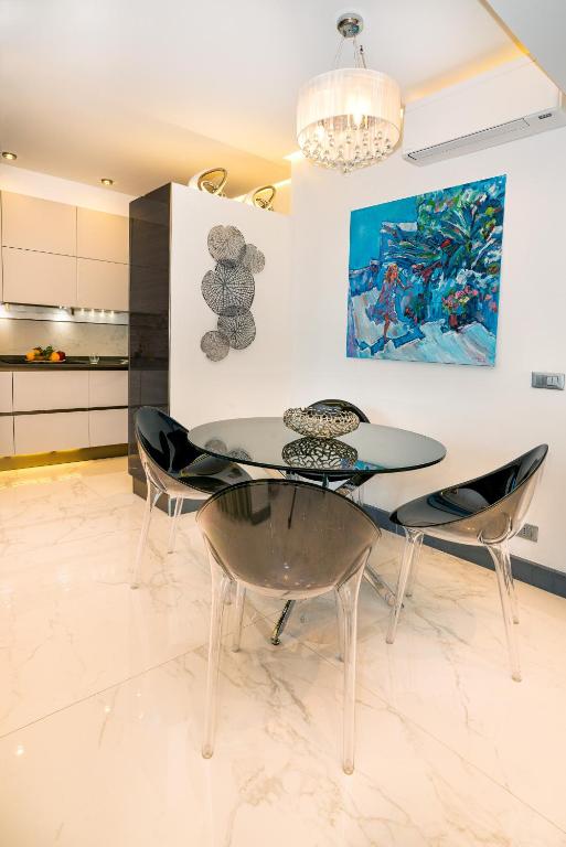 A kitchen or kitchenette at Luxury Beachfront Apartment Taormina Pool and Parking