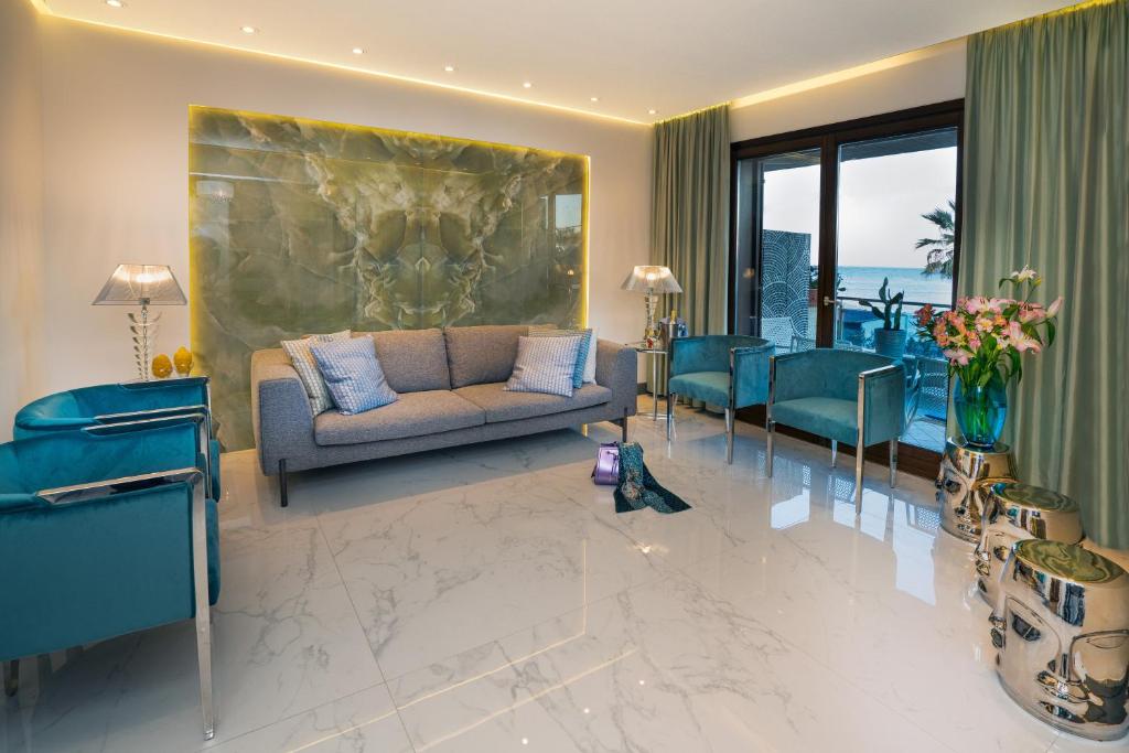 A seating area at Luxury Beachfront Apartment Taormina Pool and Parking
