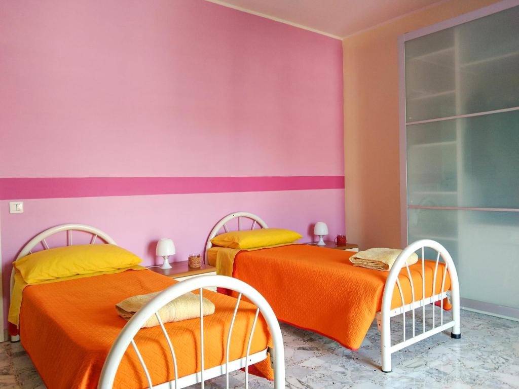 Postel nebo postele na pokoji v ubytování Casa Bignardi - Affitti Brevi Italia