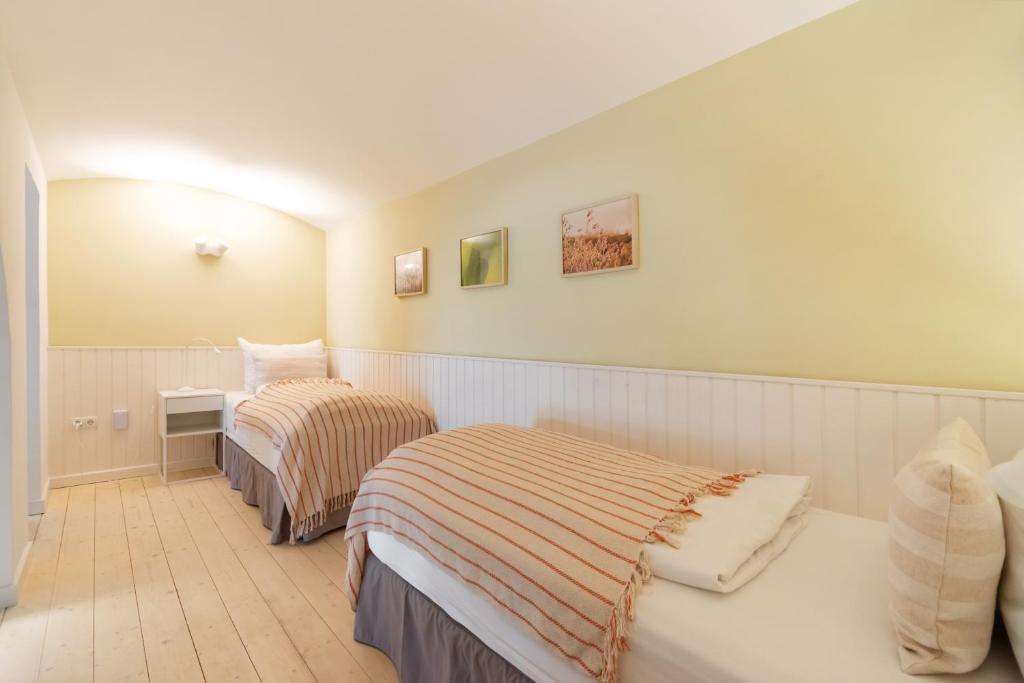 Postel nebo postele na pokoji v ubytování Vorgarten Apartments - central, new and stylish for your comfortable stay in Vienna