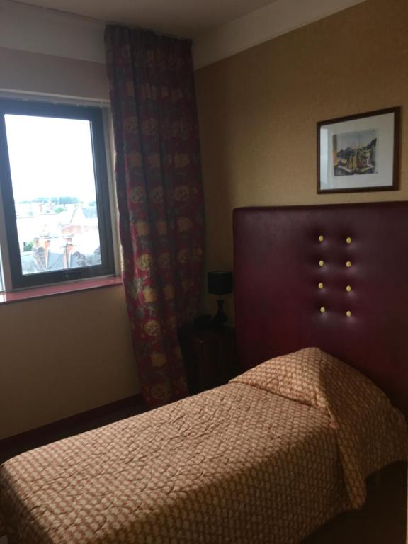 Postel nebo postele na pokoji v ubytování Hotel Dorele