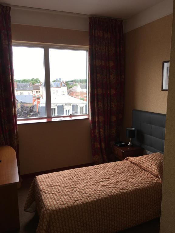 Postel nebo postele na pokoji v ubytování Hotel Dorele