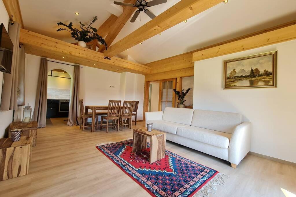 a living room with a couch and a table at Ferienwohnung Otto in Ruhpolding