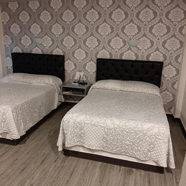 Postel nebo postele na pokoji v ubytování Hotel Kyrios Veracruz