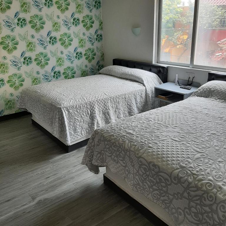 Postel nebo postele na pokoji v ubytování Hotel Kyrios Veracruz