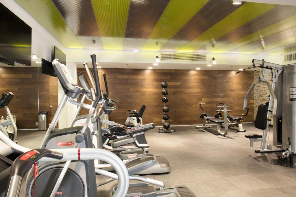 A bright, well-equipped hotel gym with cardio and strength machines.