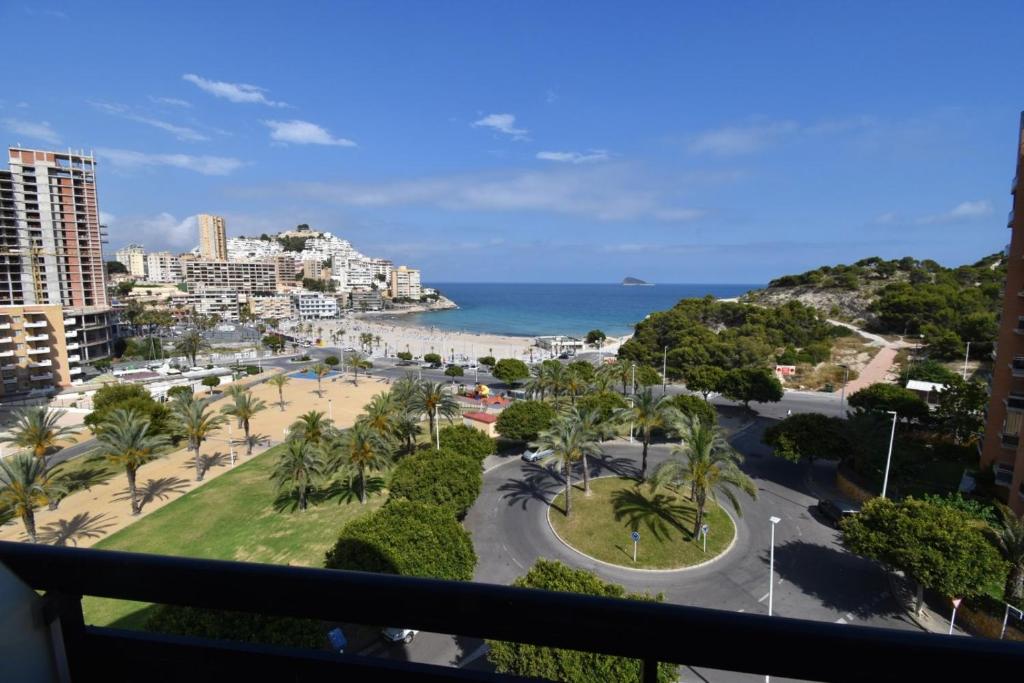 a view of the beach from the balcony of a resort at Sidney in Cala de Finestrat