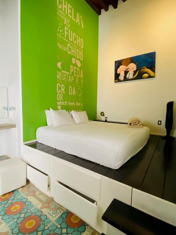 Postel nebo postele na pokoji v ubytování Kuku Ruku Hotel