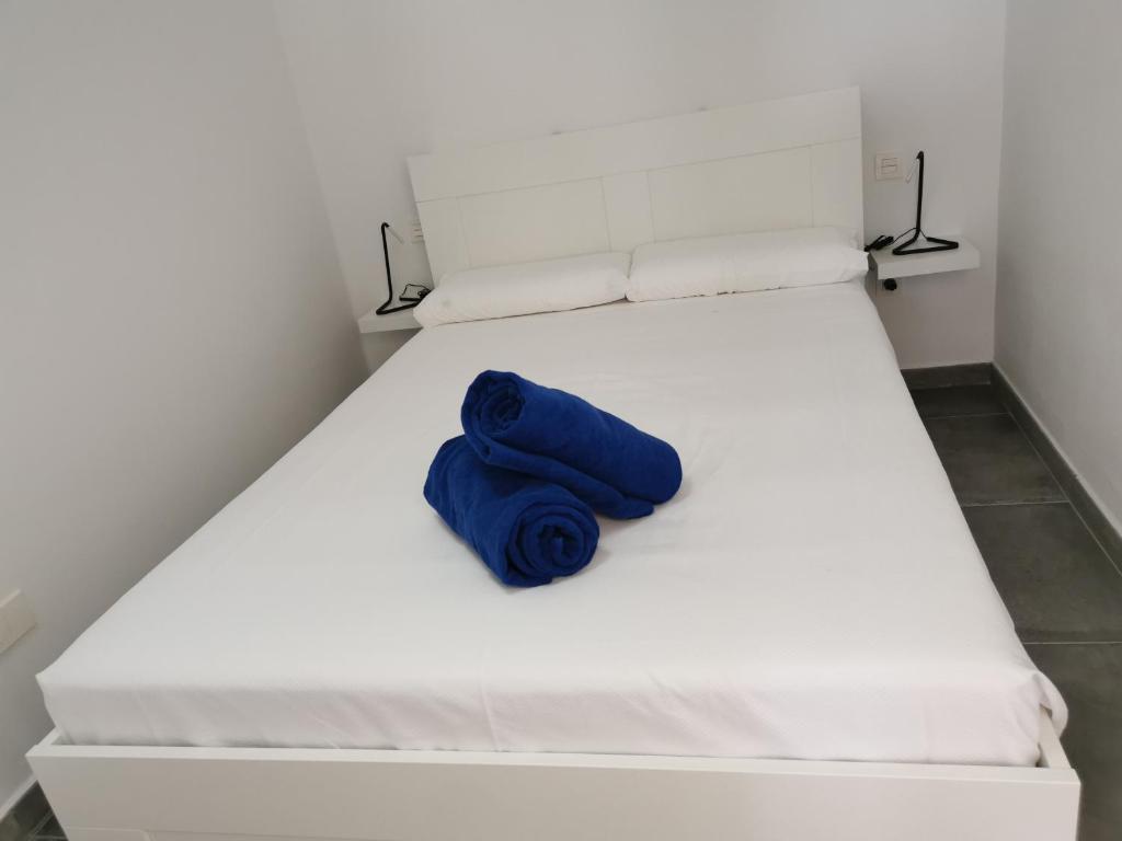 Posteľ alebo postele v izbe v ubytovaní Apartamentos Anjomacar A