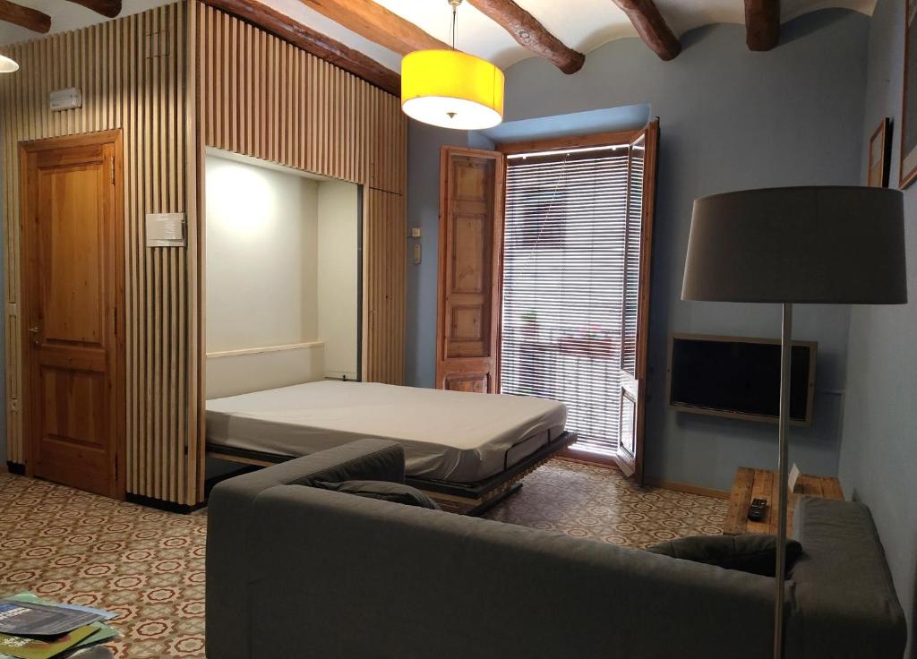 Postel nebo postele na pokoji v ubytování Apartaments Falset