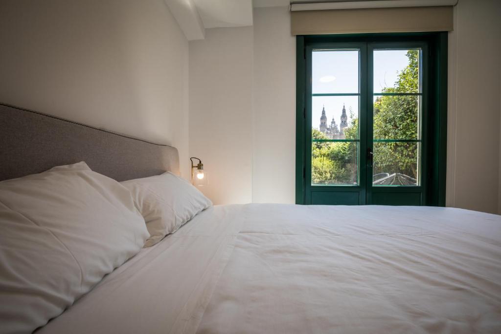 Postel nebo postele na pokoji v ubytování Hotel Pombal Rooms