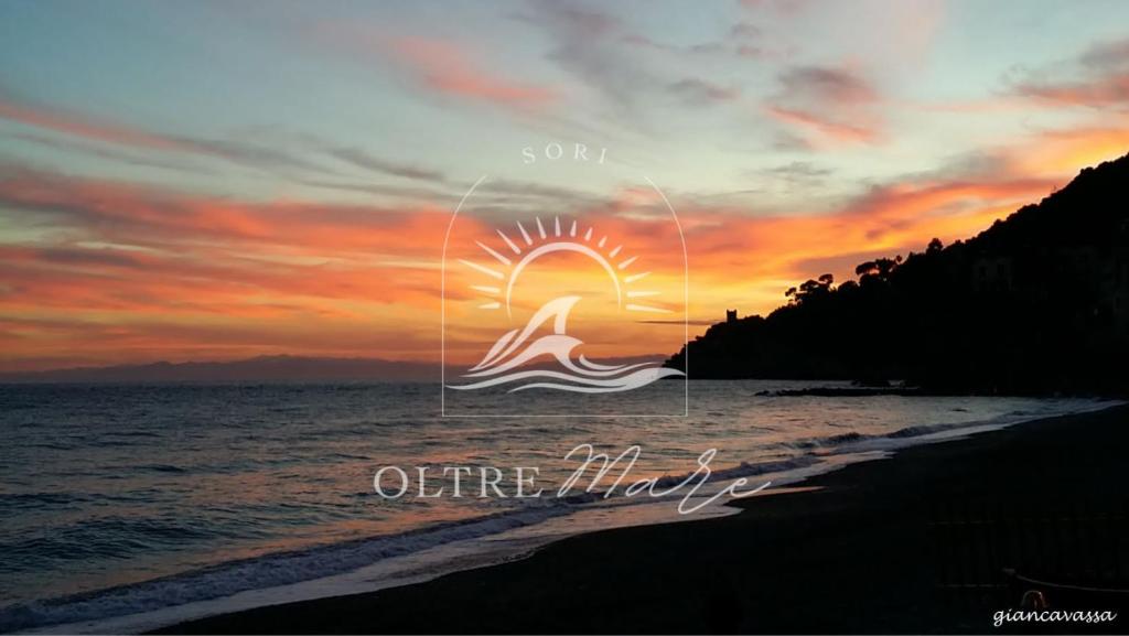 a picture of a sunset on the beach at Oltre Mare in Sori