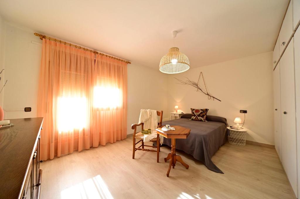 Postel nebo postele na pokoji v ubytování Casa Guineu