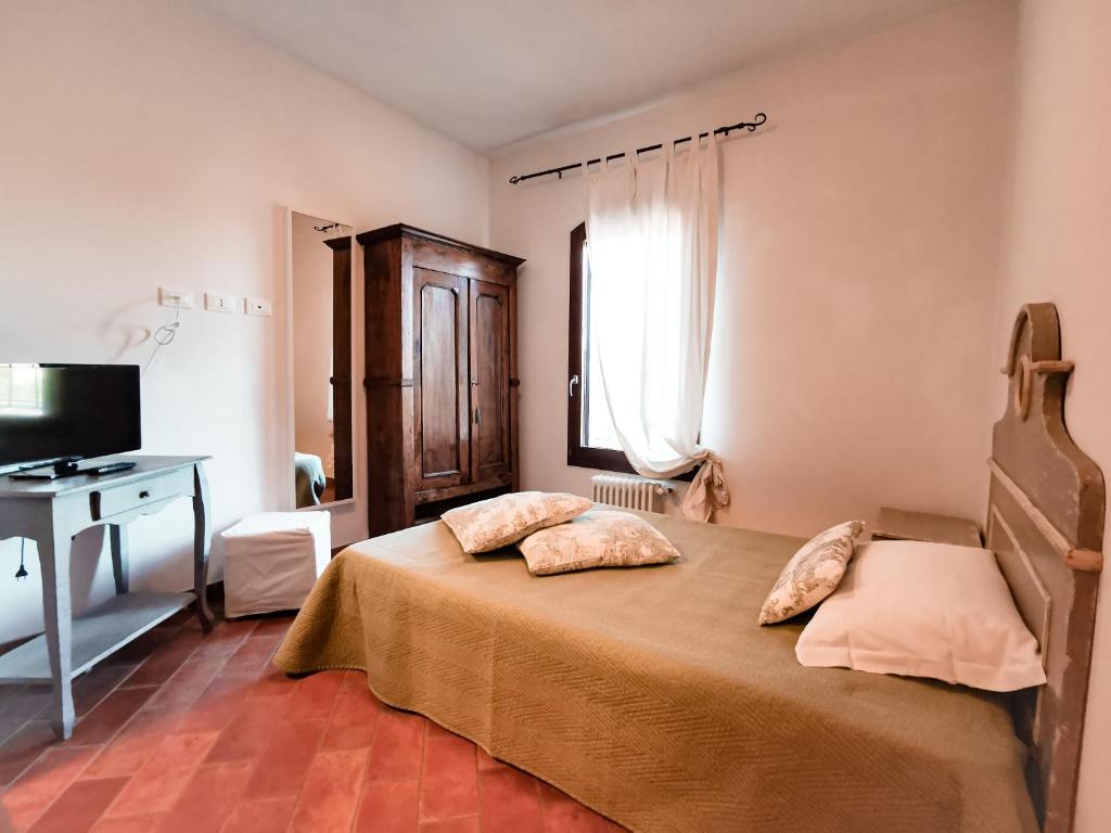 Postel nebo postele na pokoji v ubytování Locanda Acervum