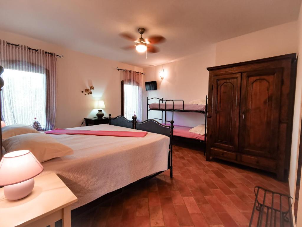 Postel nebo postele na pokoji v ubytování Locanda Acervum