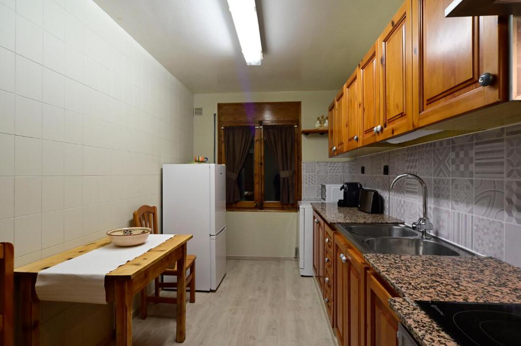 Kuchyň nebo kuchyňský kout v ubytování Casa Guineu
