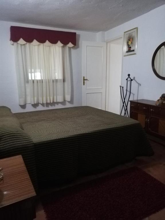 Postel nebo postele na pokoji v ubytování Casa Mari Carmen y Jose