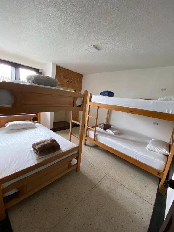 Voodi või voodid majutusasutuse Les Balcons Hostel toas