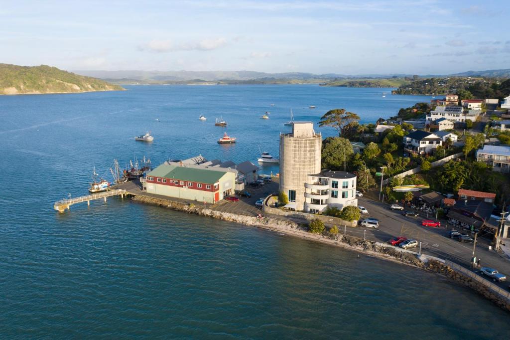 an aerial view of a harbor with boats in the water at The Silos Apartments in Raglan