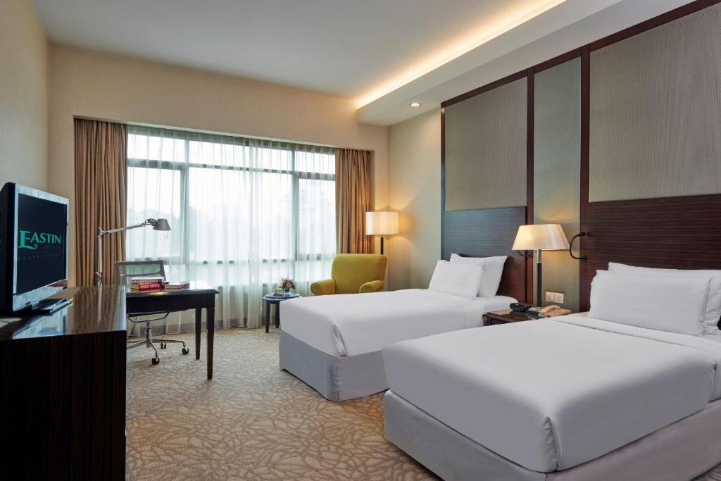 Postel nebo postele na pokoji v ubytování Eastin Hotel Kuala Lumpur