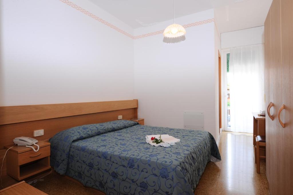 Postel nebo postele na pokoji v ubytování Hotel Marina