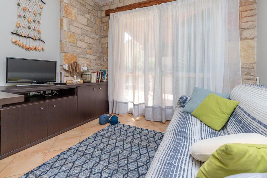 TV a/nebo společenská místnost v ubytování Apartment Rampin in Gedici