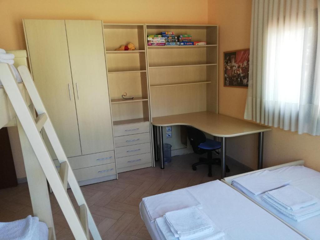 Postel nebo postele na pokoji v ubytování Villa Elva