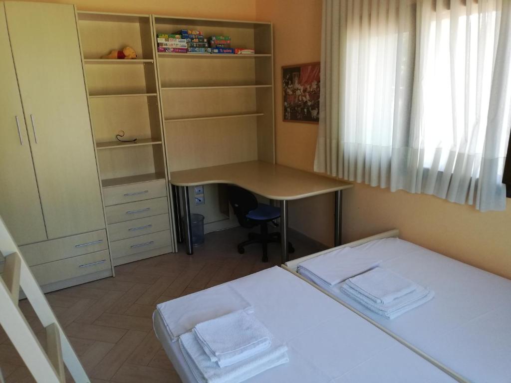 Postel nebo postele na pokoji v ubytování Villa Elva