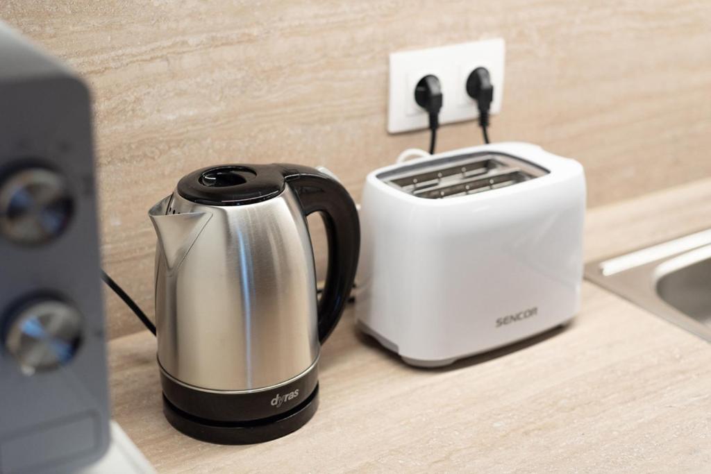Coffee and tea making facilities at Free Parking - DOB50 spacious apartment - 2 separate bedroom, 5 people, AC, WIFI