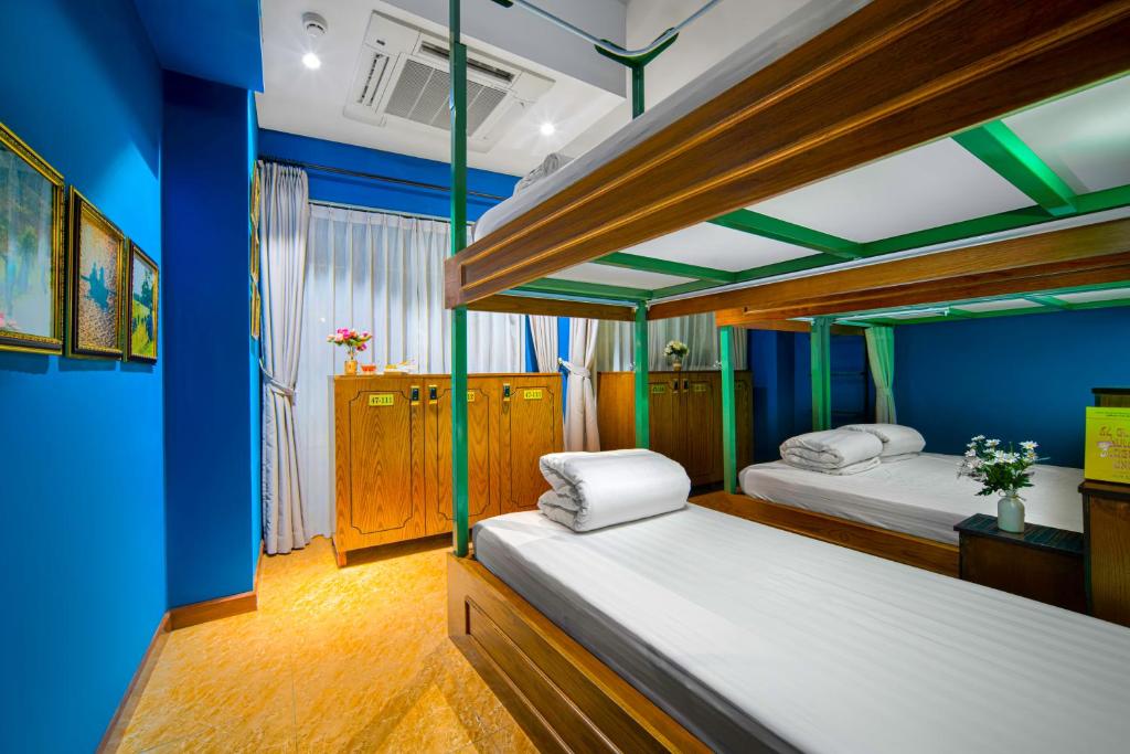 Postel nebo postele na pokoji v ubytování Little Charm Hanoi Hostel