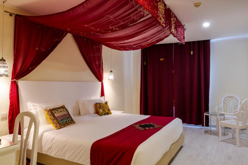 Postel nebo postele na pokoji v ubytování Hotel A.S. Lisboa