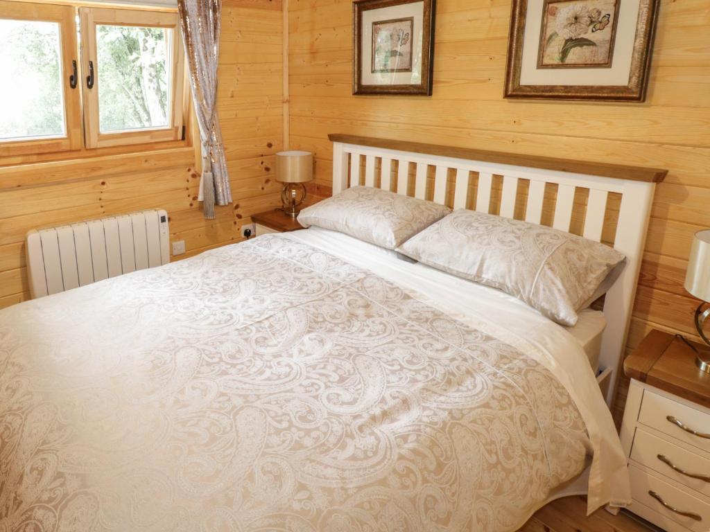 Postel nebo postele na pokoji v ubytování Port Heron Lodge