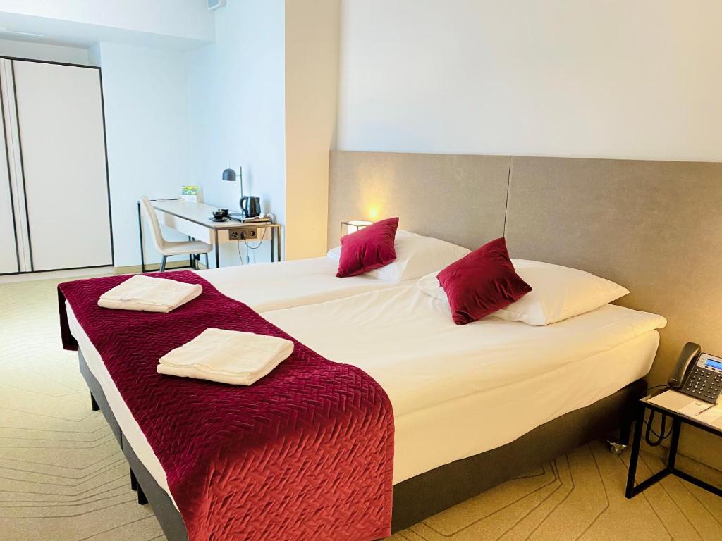 Posteľ alebo postele v izbe v ubytovaní Arche Hotel Krakowska