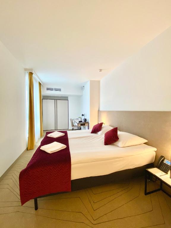 Posteľ alebo postele v izbe v ubytovaní Arche Hotel Krakowska