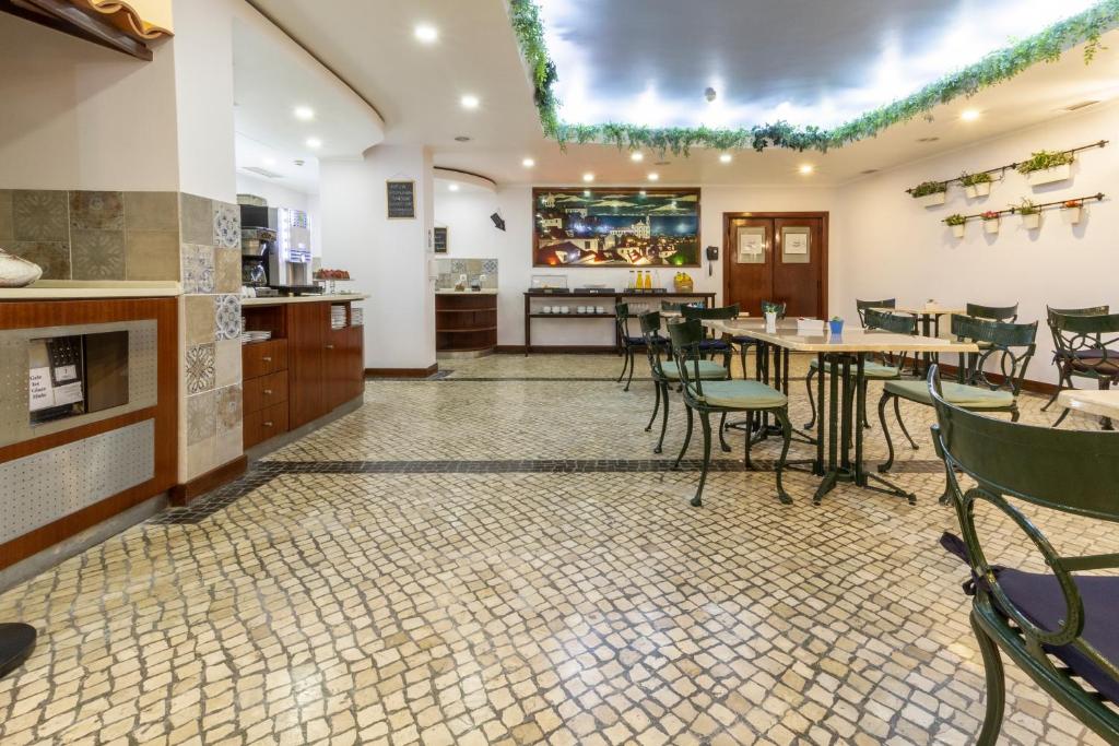 Kuchyň nebo kuchyňský kout v ubytování Hotel A.S. Lisboa