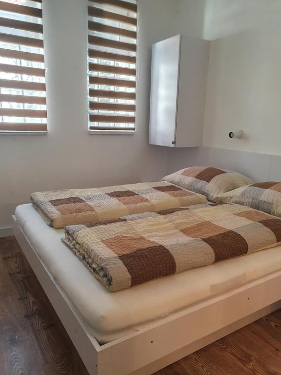 Posteľ alebo postele v izbe v ubytovaní Ivett apartmanház