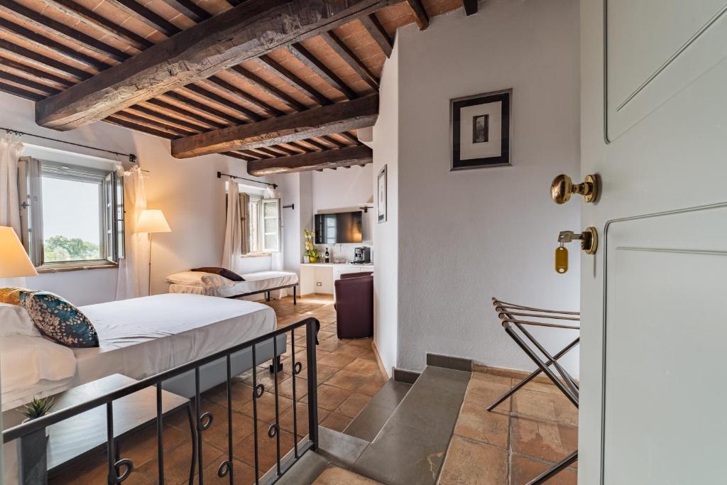 A bed or beds in a room at Locanda Della Picca