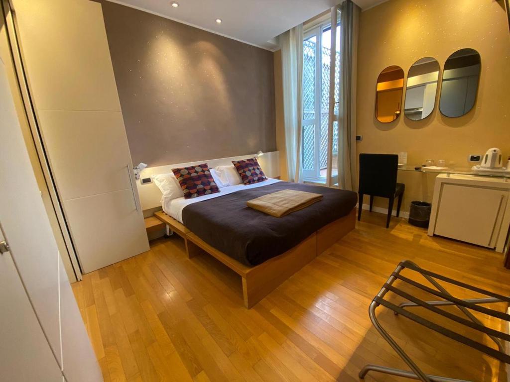Postel nebo postele na pokoji v ubytování Hotel Tritone