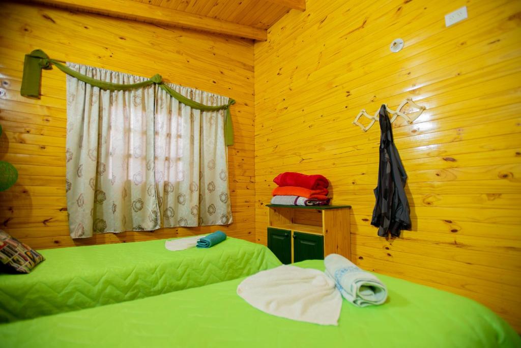 Postel nebo postele na pokoji v ubytování Cabañas La Quinta
