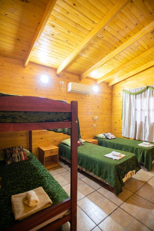 Postel nebo postele na pokoji v ubytování Cabañas La Quinta