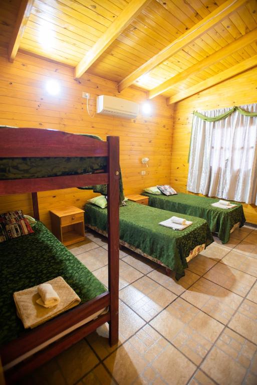 Postel nebo postele na pokoji v ubytování Cabañas La Quinta