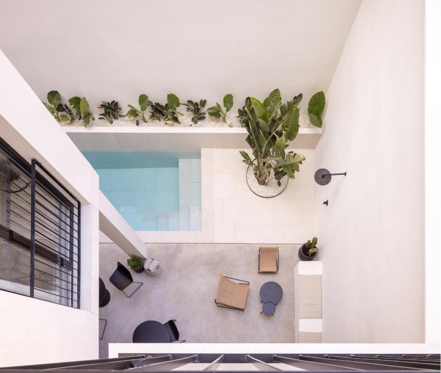 a house with a pool in the middle of it at YOURS boutique stay in Valencia